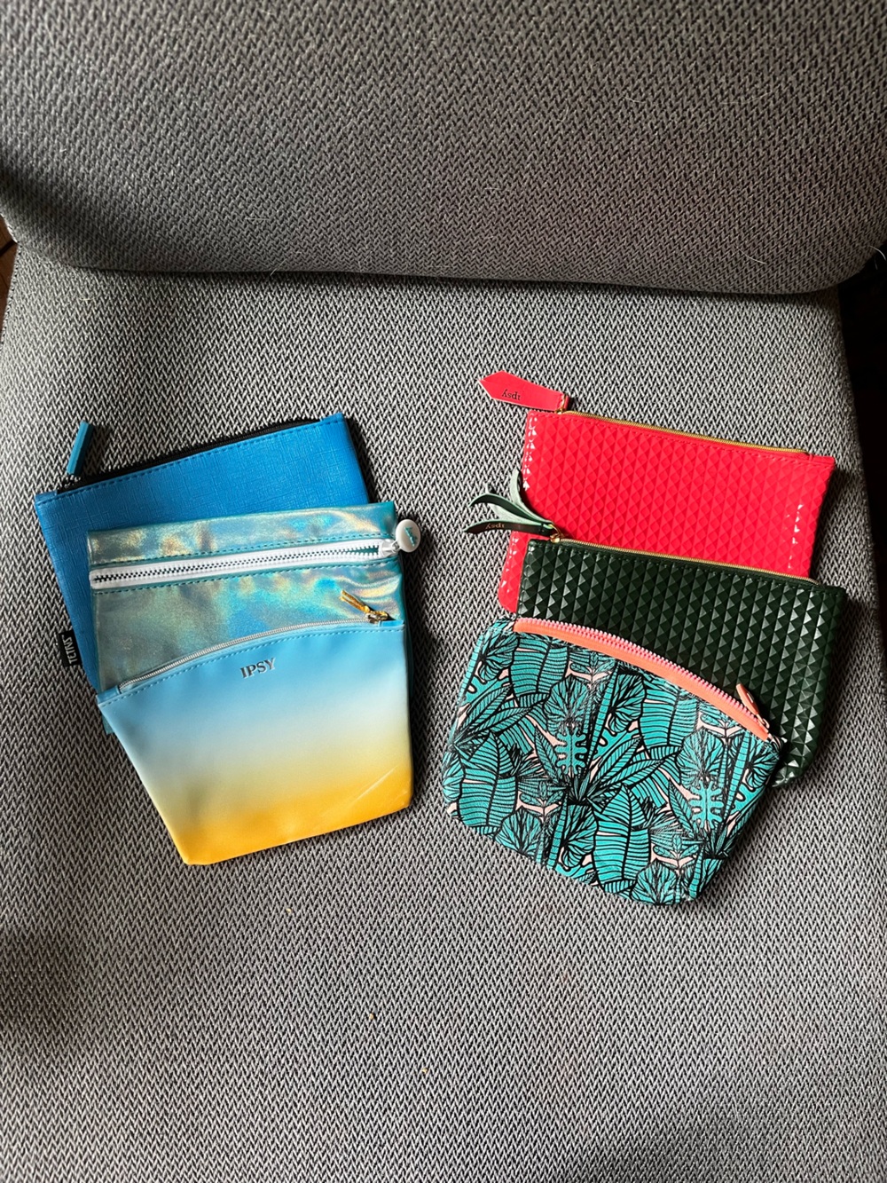 Set of 6 Ipsy Zip Bags. Blue, Black, Red. Approximately 4 x 7”